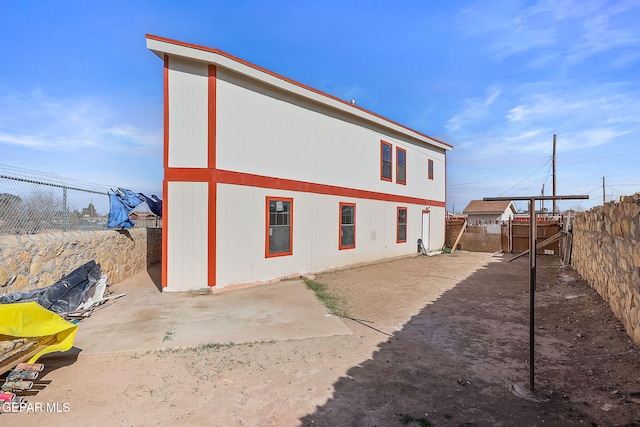 view of property exterior featuring a patio area