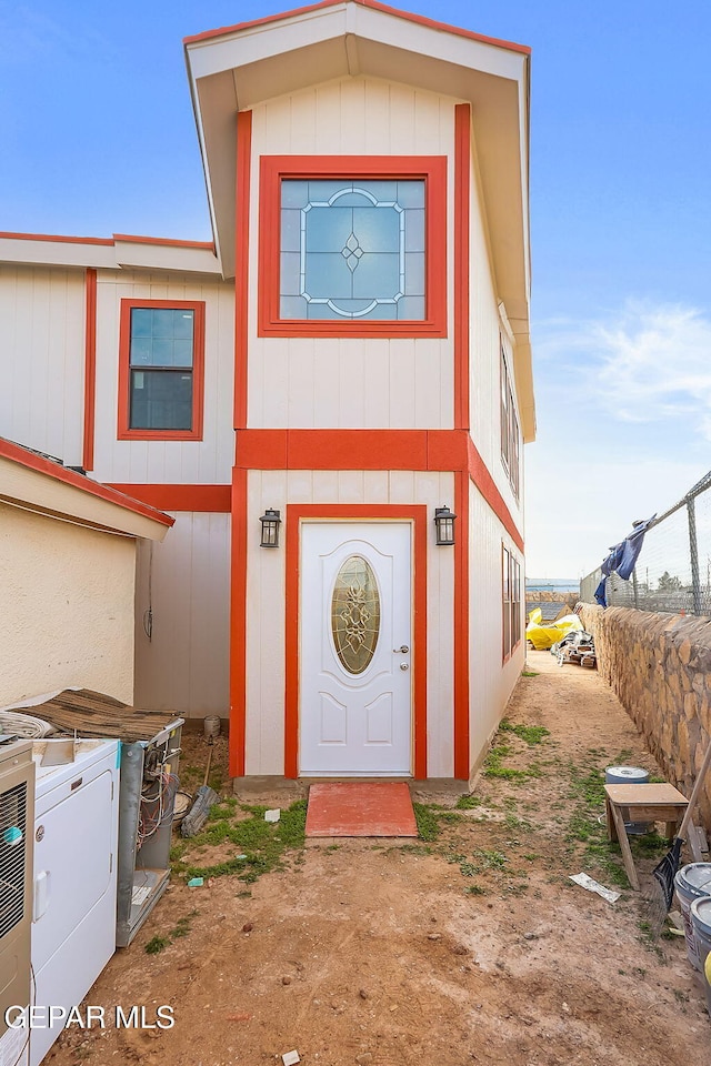 entrance to property featuring washer / dryer