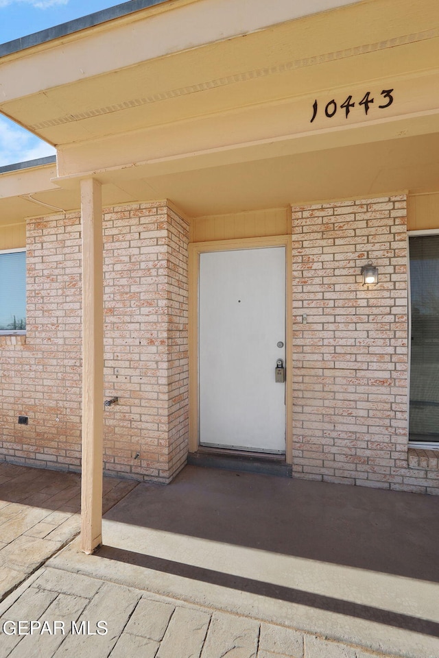 property entrance featuring a patio