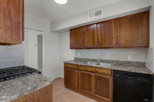 kitchen featuring sink, light tile patterned flooring, decorative backsplash, and black dishwasher