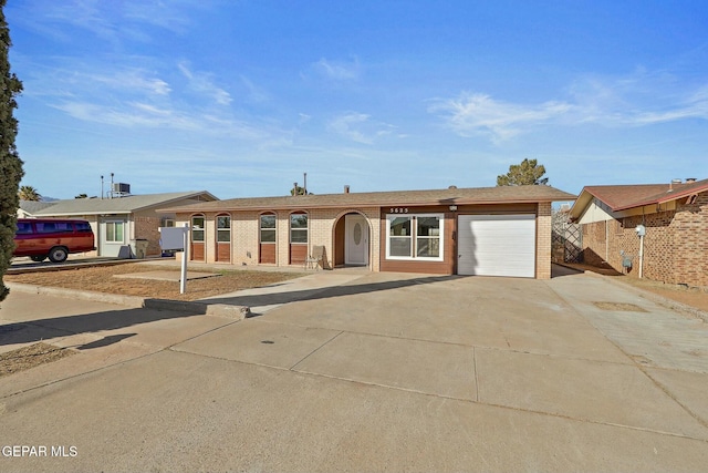 single story home featuring a garage