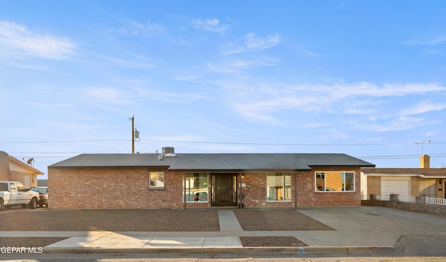 ranch-style home featuring a garage