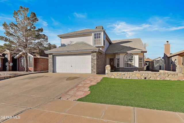 view of front of house featuring a front lawn and a garage