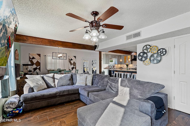 living room featuring french doors, beam ceiling, and ceiling fan