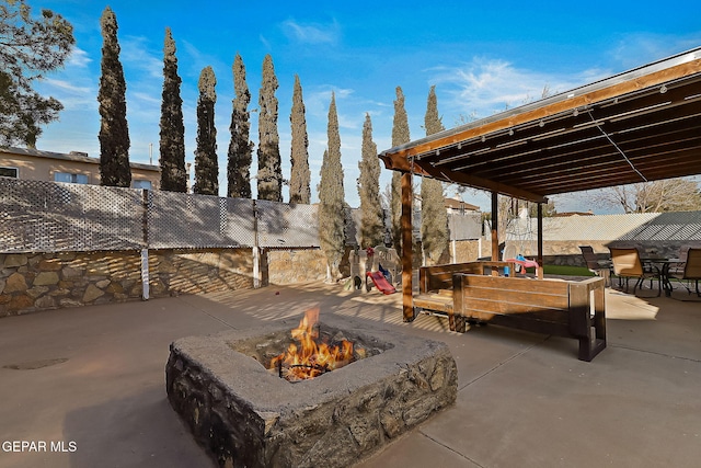 view of patio / terrace featuring a fire pit