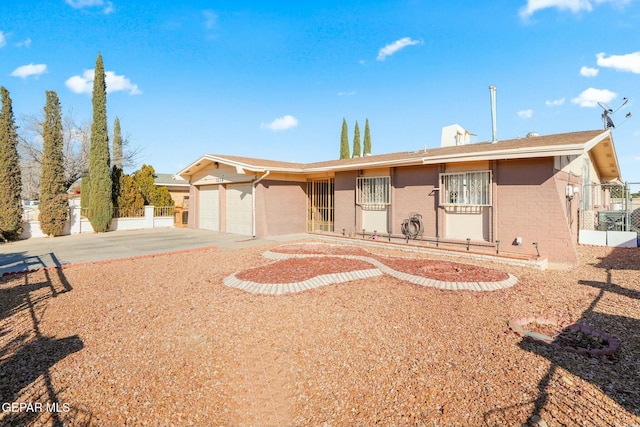 single story home with a garage