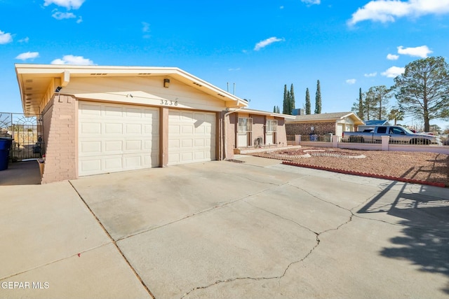 ranch-style home featuring a garage