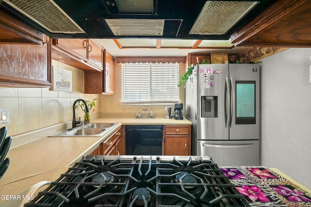 kitchen featuring sink, stainless steel fridge with ice dispenser, and dishwasher