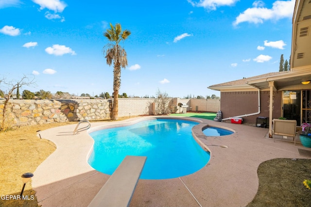 view of pool featuring a patio and a diving board