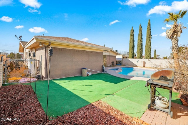 view of swimming pool featuring a grill