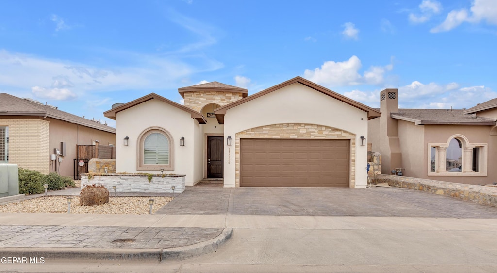 mediterranean / spanish-style home featuring a garage