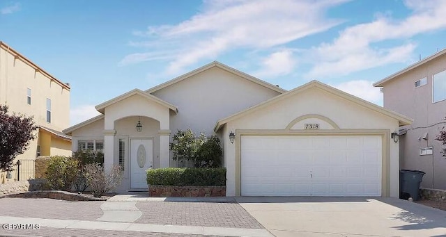 view of front of property with a garage