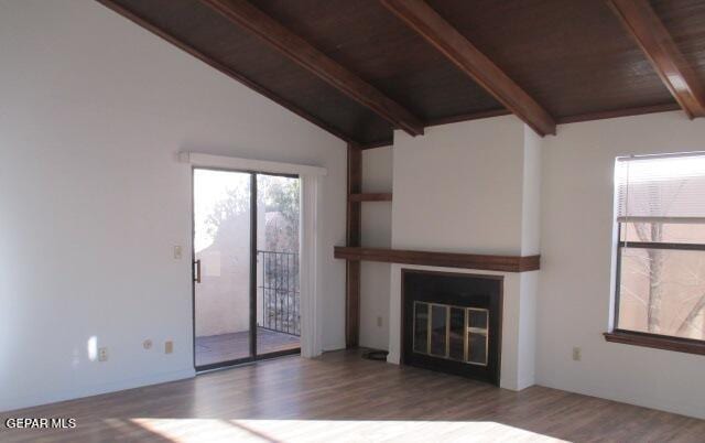 unfurnished living room featuring wooden ceiling, wood-type flooring, and vaulted ceiling with beams