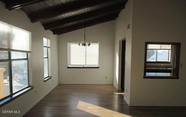 unfurnished room featuring a wealth of natural light, wood ceiling, an inviting chandelier, dark hardwood / wood-style floors, and beam ceiling