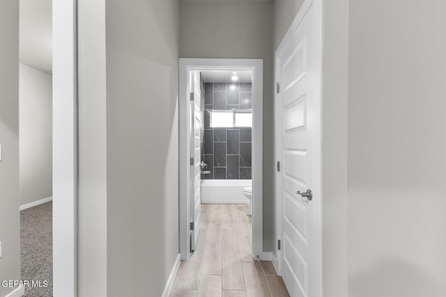 hallway featuring wood finish floors