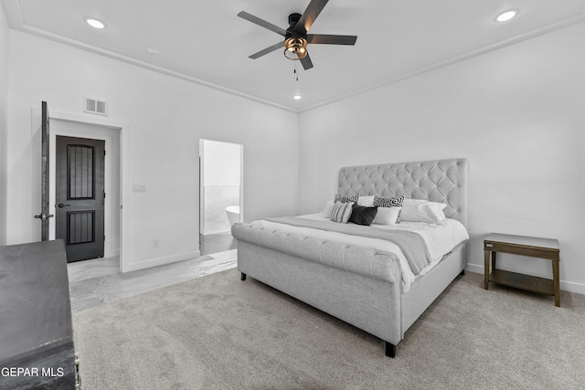 carpeted bedroom with ceiling fan, connected bathroom, and crown molding