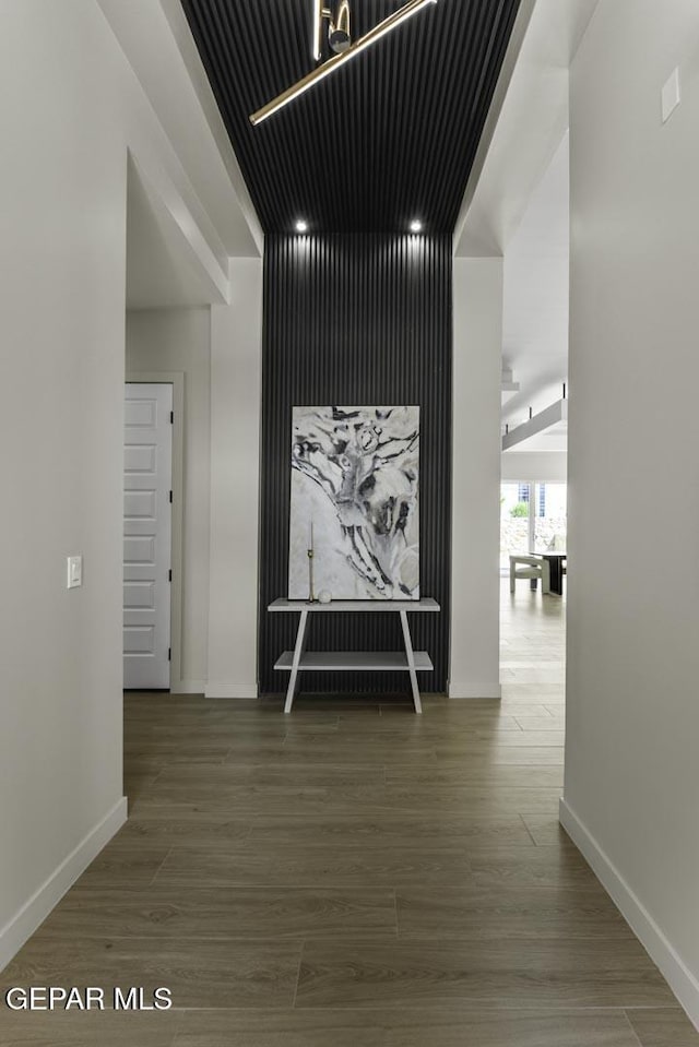 12869 Kingsbury Ave, Horizon City, TX 79928 - hall featuring wood finished floors and baseboards