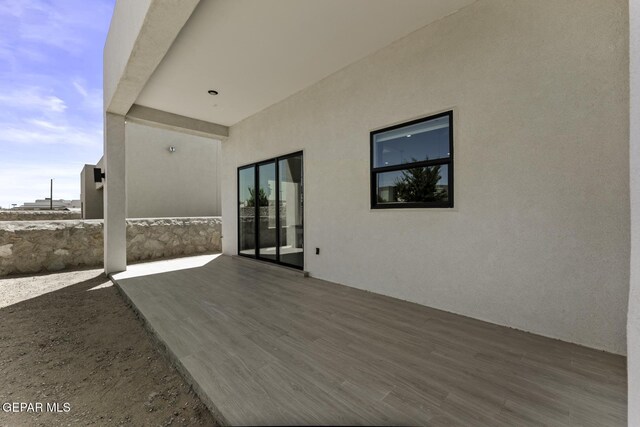 12869 Kingsbury Ave, Horizon City, TX 79928 - wooden terrace featuring a patio