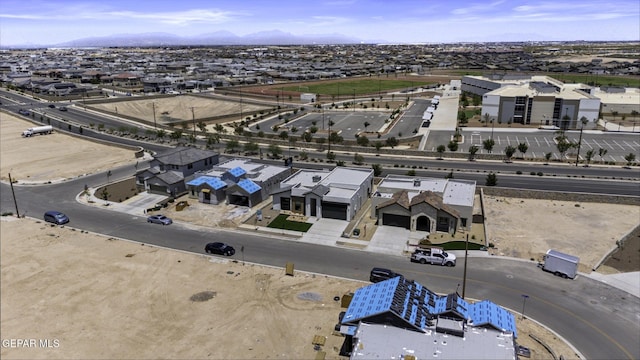 12869 Kingsbury Ave, Horizon City, TX 79928 - aerial perspective of suburban area with mountains