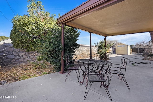 view of patio featuring a storage shed