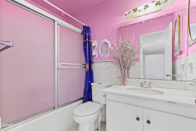 full bathroom with toilet, vanity, and shower / bath combination with glass door