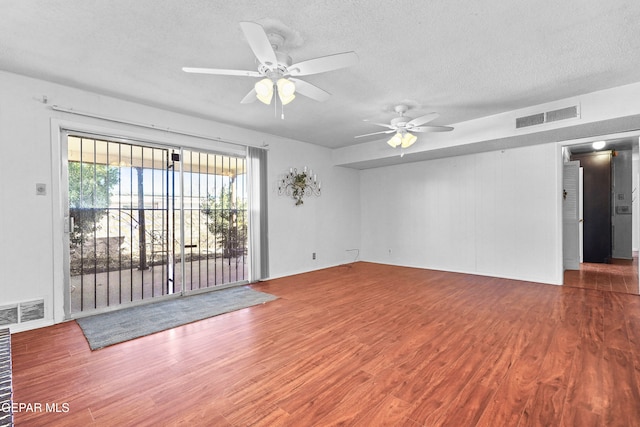 spare room featuring ceiling fan, a textured ceiling, and hardwood / wood-style floors