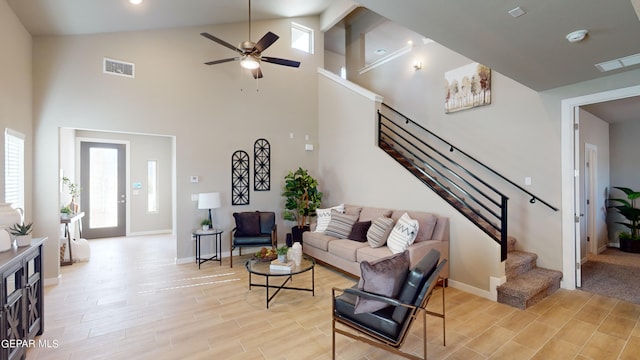 living room with high vaulted ceiling and ceiling fan