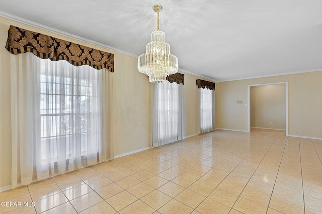 tiled empty room featuring an inviting chandelier, crown molding, and a healthy amount of sunlight