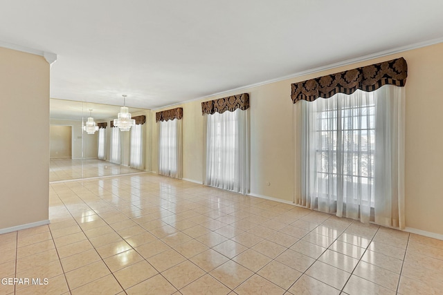 tiled spare room featuring crown molding and an inviting chandelier