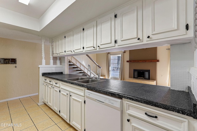 kitchen featuring sink, white cabinetry, and dishwasher