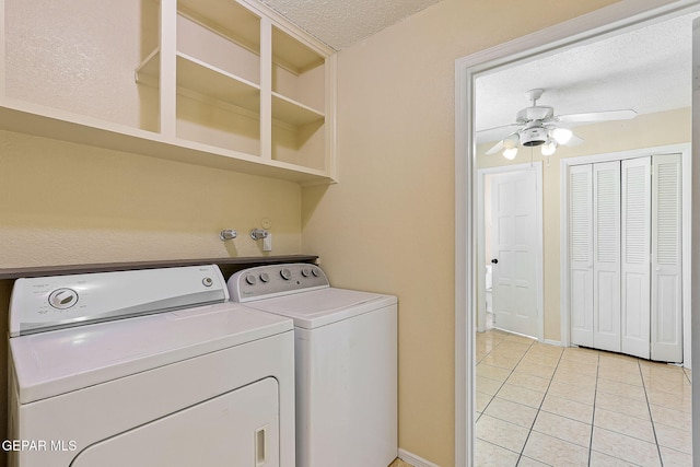 laundry area with ceiling fan, separate washer and dryer, a textured ceiling, and light tile patterned floors