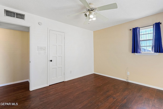 unfurnished bedroom featuring a textured ceiling, ceiling fan, dark hardwood / wood-style flooring, and a closet