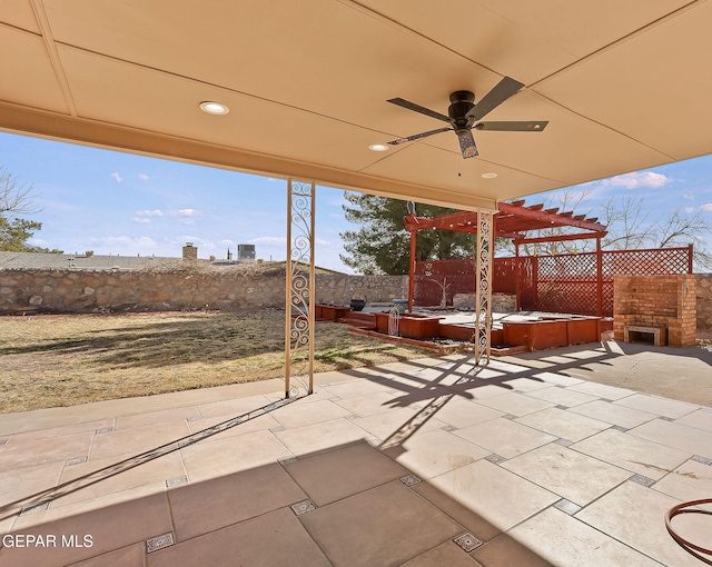 view of patio featuring ceiling fan and a pergola