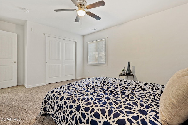 carpeted bedroom featuring a closet and ceiling fan