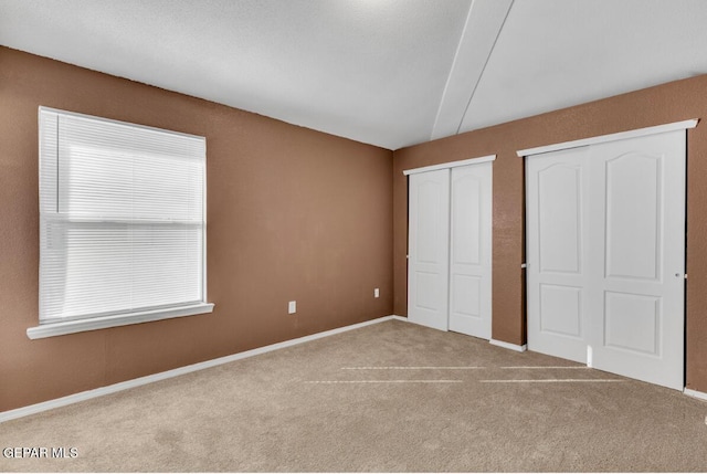 unfurnished bedroom with light carpet