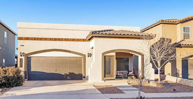 mediterranean / spanish-style house featuring a garage