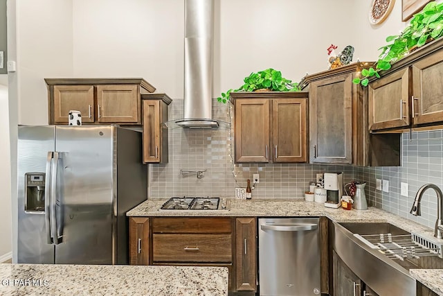 kitchen featuring sink, backsplash, ventilation hood, and stainless steel appliances