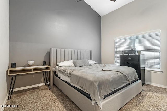 carpeted bedroom featuring lofted ceiling