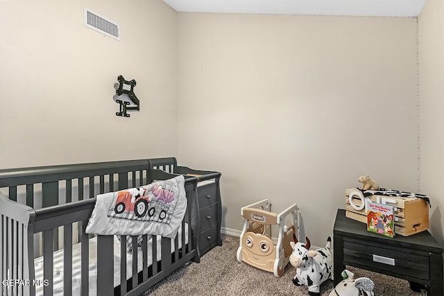 carpeted bedroom with a crib