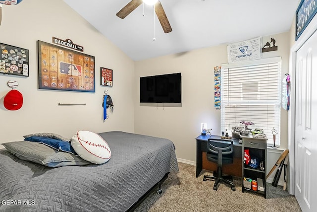 bedroom featuring ceiling fan, carpet, a closet, and vaulted ceiling