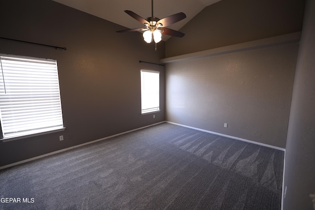 carpeted empty room with vaulted ceiling and ceiling fan