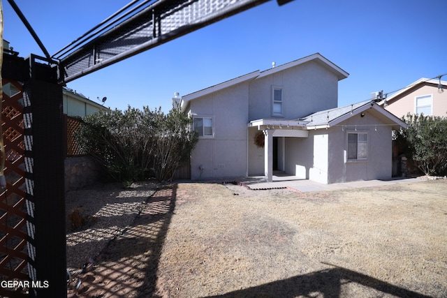 rear view of house with a patio area