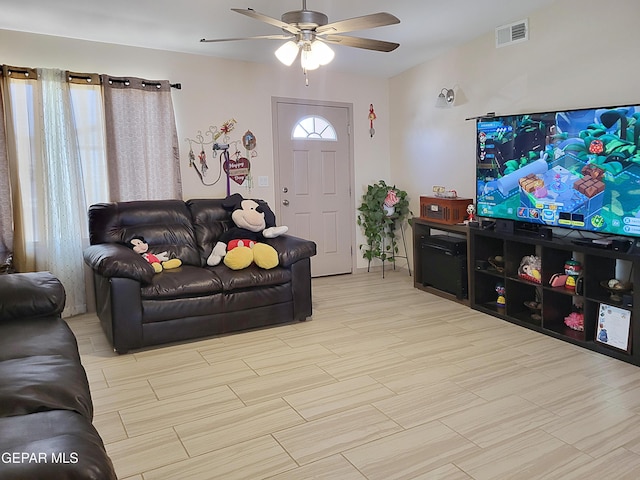 living room with ceiling fan