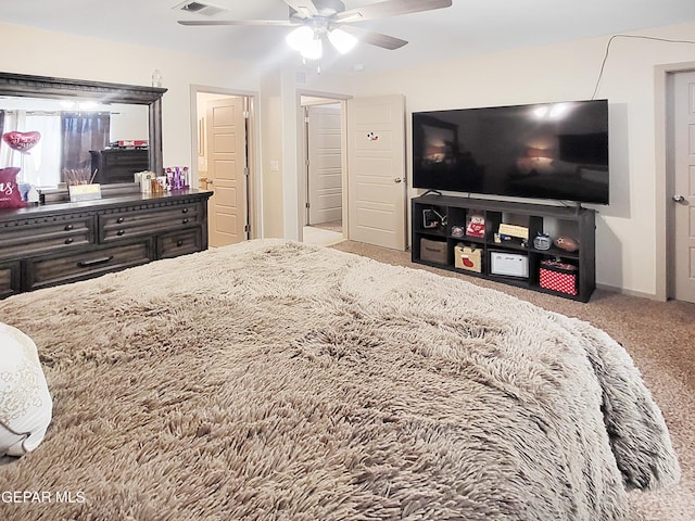 bedroom with ceiling fan and light carpet