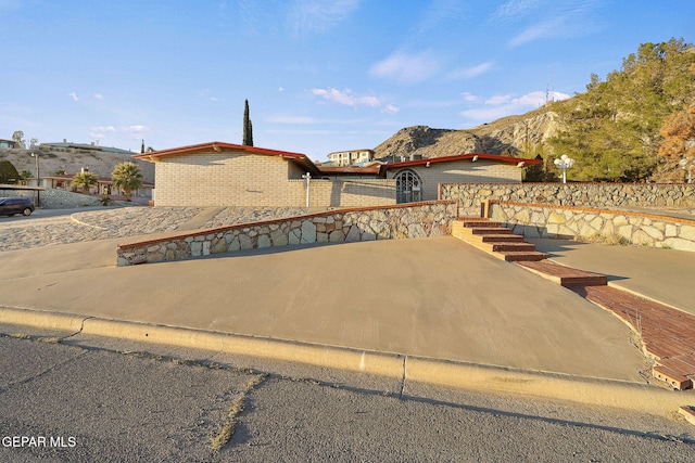 view of front of property with a mountain view