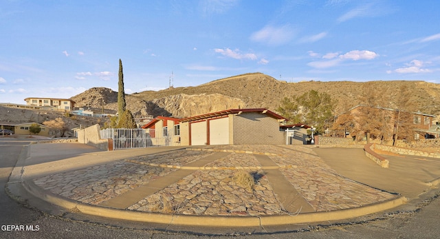 view of front of house with a garage and a mountain view