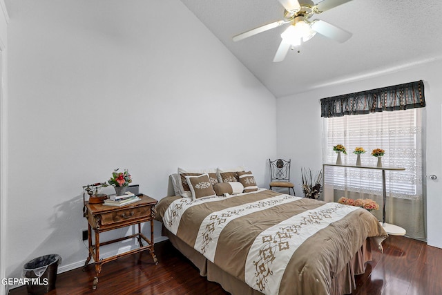 bedroom featuring lofted ceiling, ceiling fan, baseboards, and wood finished floors