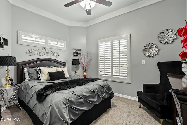 bedroom with ceiling fan and light colored carpet