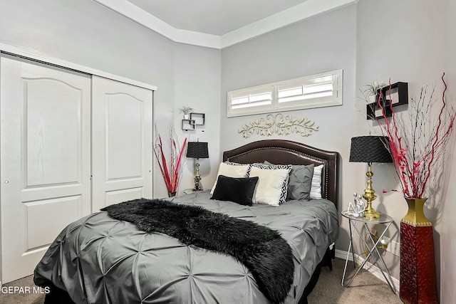 carpeted bedroom with a closet