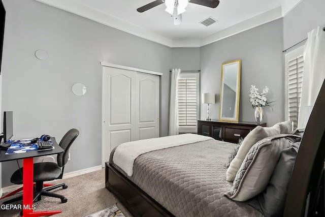 bedroom featuring a closet, carpet flooring, and ceiling fan